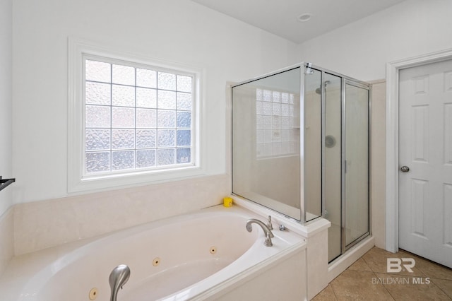 bathroom featuring tile patterned floors and shower with separate bathtub