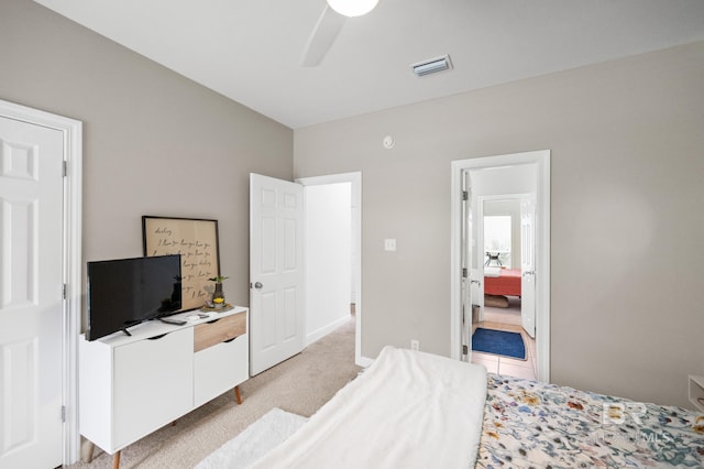 bedroom featuring ceiling fan and light carpet