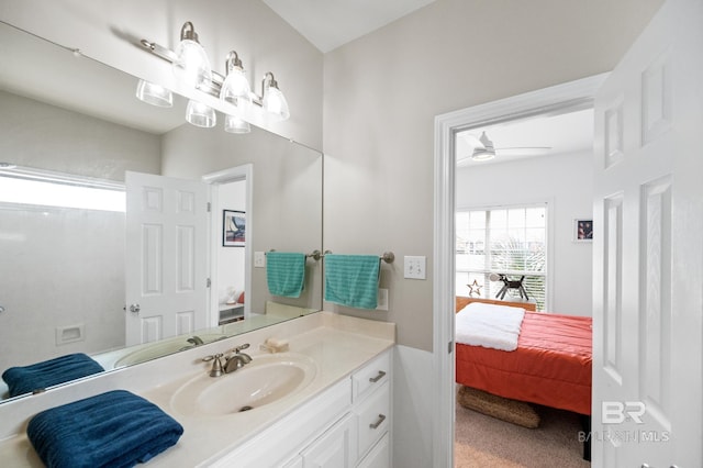 bathroom with ceiling fan and vanity