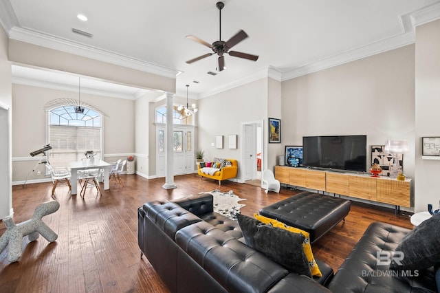 living room with wood-type flooring and crown molding