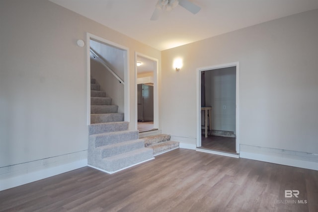 unfurnished room featuring dark hardwood / wood-style flooring and ceiling fan