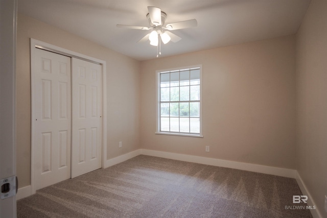 unfurnished bedroom with carpet flooring, a closet, and ceiling fan