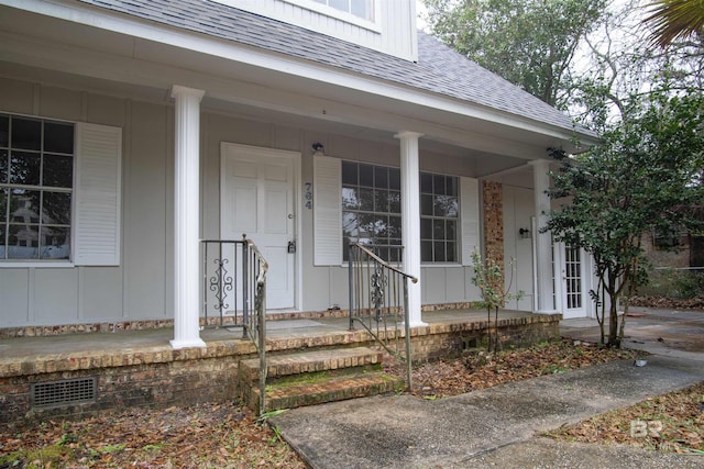 property entrance with covered porch