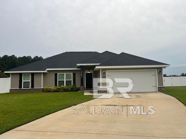 ranch-style house with a front lawn and a garage