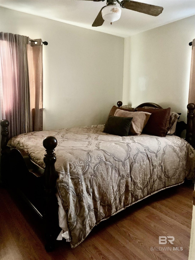 bedroom featuring wood-type flooring and ceiling fan