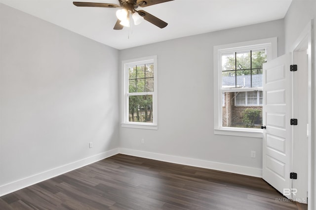 empty room featuring dark hardwood / wood-style floors and ceiling fan