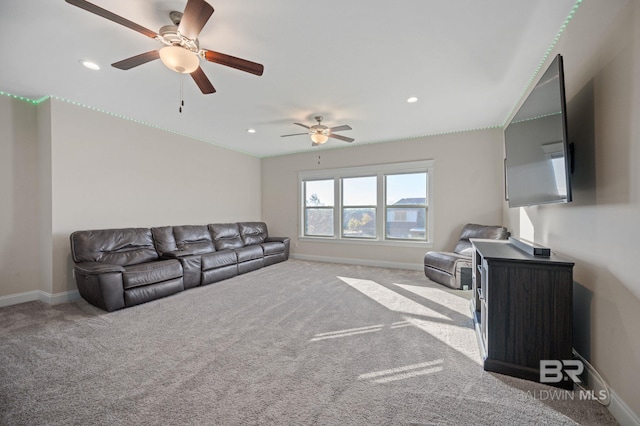 carpeted living room featuring ceiling fan