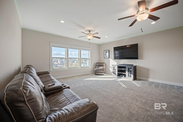 living room featuring ceiling fan and carpet