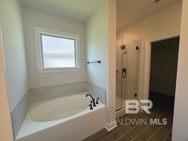 bathroom featuring plus walk in shower