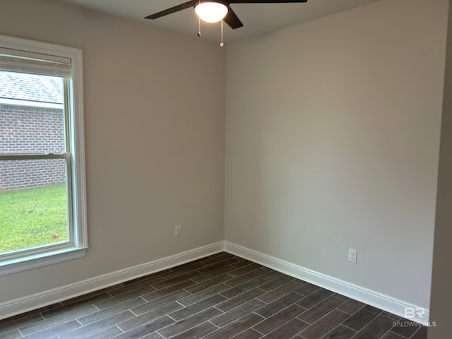 empty room featuring ceiling fan and a healthy amount of sunlight