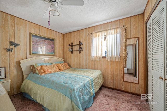 bedroom featuring a textured ceiling, a closet, and ceiling fan