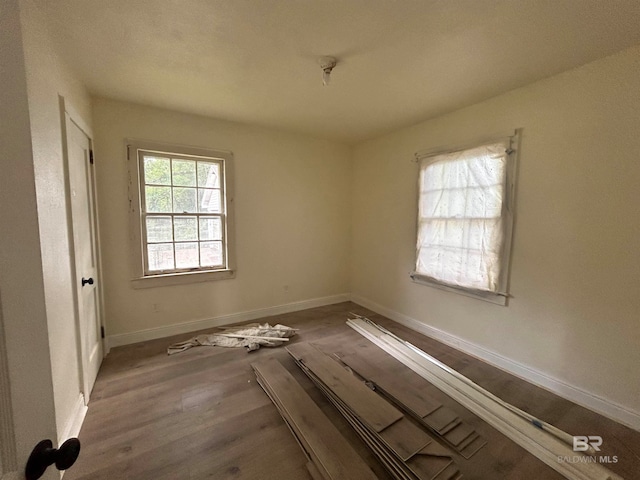 unfurnished room with light hardwood / wood-style floors