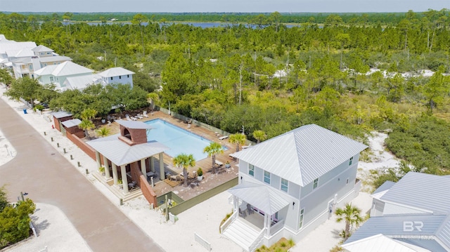 bird's eye view featuring a wooded view