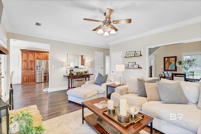 26506 Big Grant Way, Robertsdale, AL 36567 - living area featuring dark wood finished floors, ornamental molding, and a ceiling fan