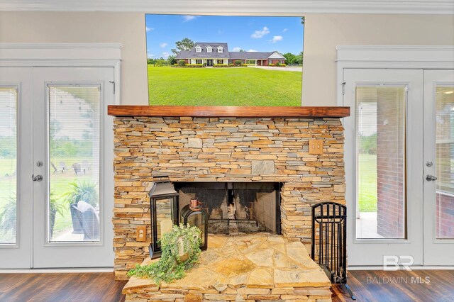 26506 Big Grant Way, Robertsdale, AL 36567 - detailed view of french doors, wood finished floors, and a fireplace