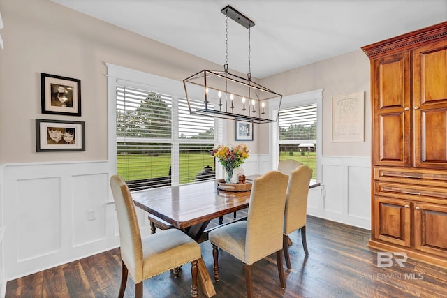 26506 Big Grant Way, Robertsdale, AL 36567 - dining room featuring a decorative wall, wainscoting, a chandelier, and dark wood-style flooring