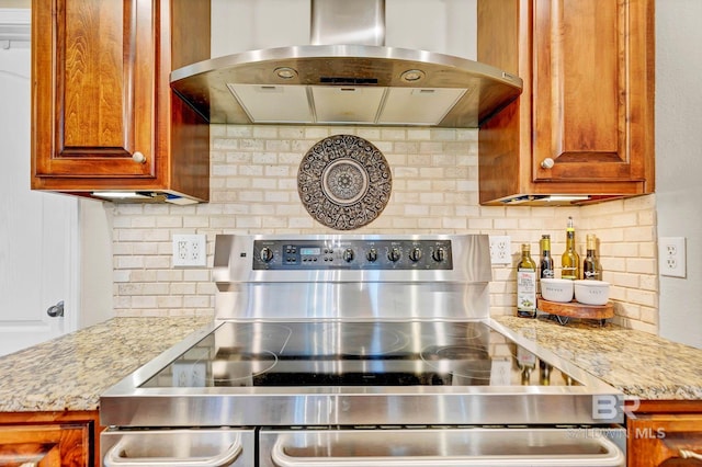26506 Big Grant Way, Robertsdale, AL 36567 - kitchen featuring extractor fan, stainless steel electric stove, decorative backsplash, and brown cabinets
