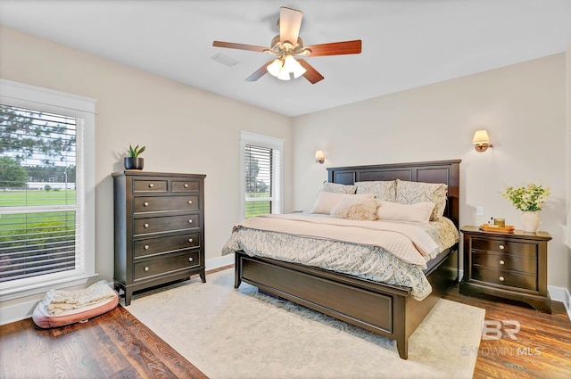 26506 Big Grant Way, Robertsdale, AL 36567 - bedroom with wood finished floors and a ceiling fan
