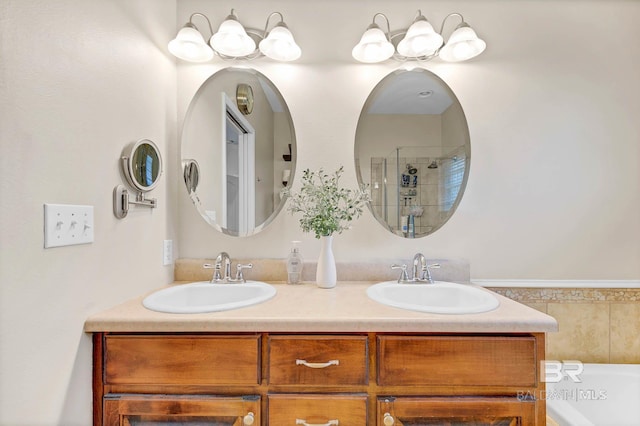 26506 Big Grant Way, Robertsdale, AL 36567 - bathroom featuring double vanity, a bathtub, and a shower