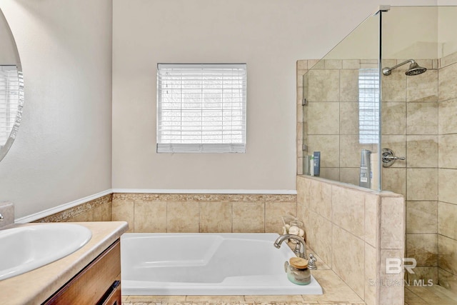 26506 Big Grant Way, Robertsdale, AL 36567 - bathroom with tiled shower, vanity, and a garden tub