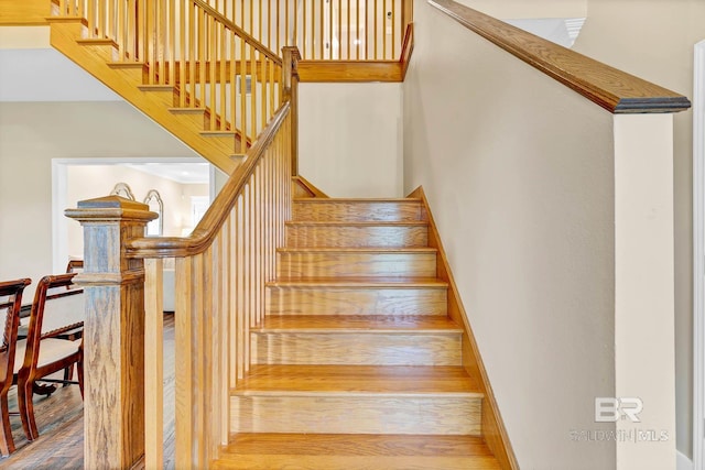 26506 Big Grant Way, Robertsdale, AL 36567 - stairway with wood finished floors and a towering ceiling
