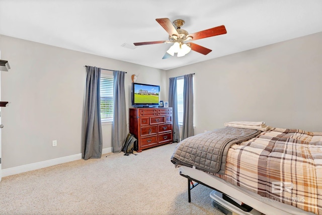 26506 Big Grant Way, Robertsdale, AL 36567 - bedroom with multiple windows, a ceiling fan, and light carpet