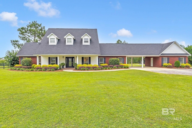26506 Big Grant Way, Robertsdale, AL 36567 - cape cod home featuring concrete driveway, a front lawn, an attached carport, and a shingled roof