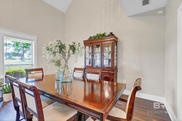 26506 Big Grant Way, Robertsdale, AL 36567 - dining room with wood finished floors and high vaulted ceiling