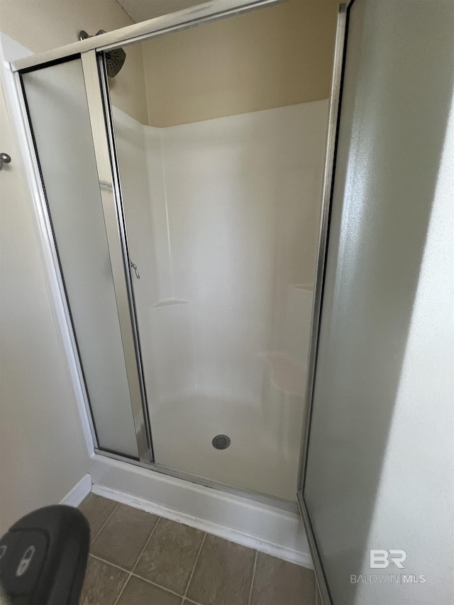 bathroom featuring tile patterned floors and walk in shower