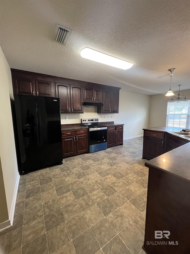 kitchen featuring electric stove, dark brown cabinetry, a textured ceiling, black fridge, and decorative light fixtures