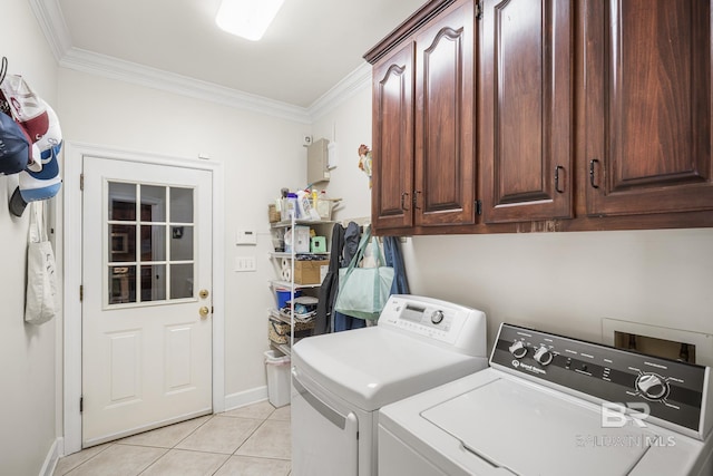 402 Potters Mill Ave, Daphne, AL 36526 - washroom featuring washing machine and clothes dryer, cabinet space, light tile patterned flooring, crown molding, and baseboards