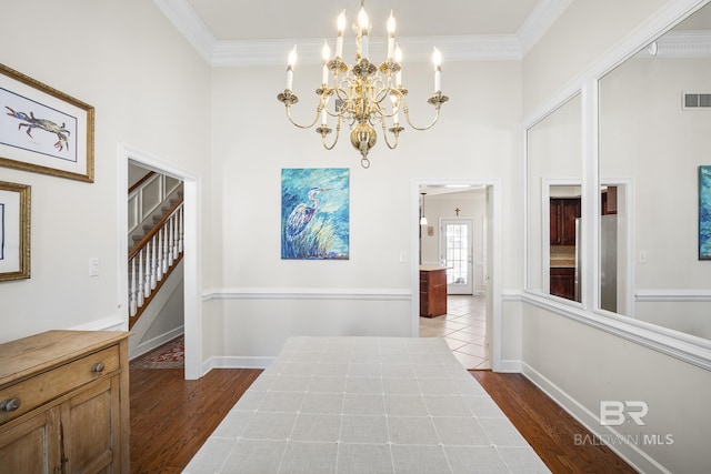 402 Potters Mill Ave, Daphne, AL 36526 - hall featuring a chandelier, a towering ceiling, dark wood-style floors, crown molding, and baseboards