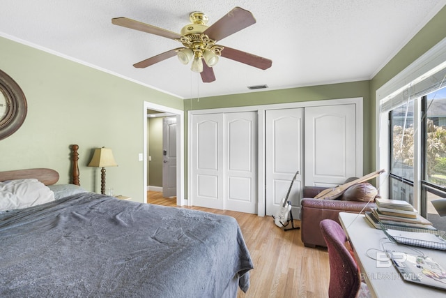 1095 Sea Cliff S Unit 1095, Daphne, AL 36526 - bedroom featuring a ceiling fan, light wood-style floors, ornamental molding, and visible vents