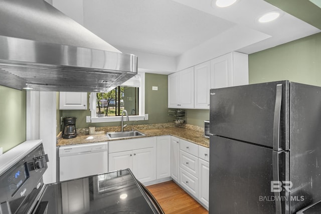 1095 Sea Cliff S Unit 1095, Daphne, AL 36526 - kitchen with dishwasher, a sink, freestanding refrigerator, white cabinetry, and island range hood