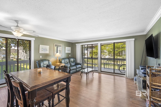 1095 Sea Cliff S Unit 1095, Daphne, AL 36526 - dining space featuring a textured ceiling, ornamental molding, a ceiling fan, and wood finished floors