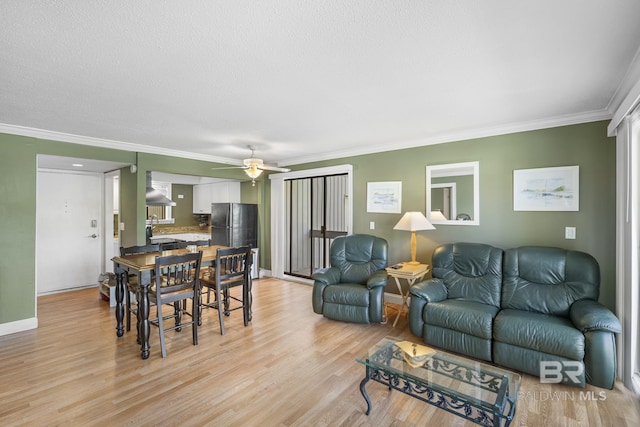 1095 Sea Cliff S Unit 1095, Daphne, AL 36526 - living room with ornamental molding, baseboards, a ceiling fan, and light wood finished floors
