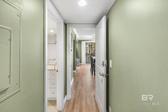 1095 Sea Cliff S Unit 1095, Daphne, AL 36526 - hallway featuring light wood-type flooring, baseboards, and a textured ceiling