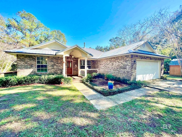 ranch-style house featuring a front yard and a garage