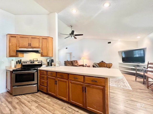 kitchen featuring kitchen peninsula, light wood-type flooring, ceiling fan, electric stove, and lofted ceiling