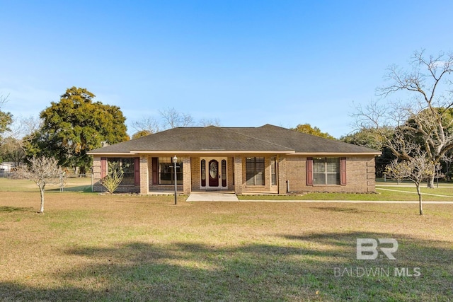 ranch-style home featuring a front yard