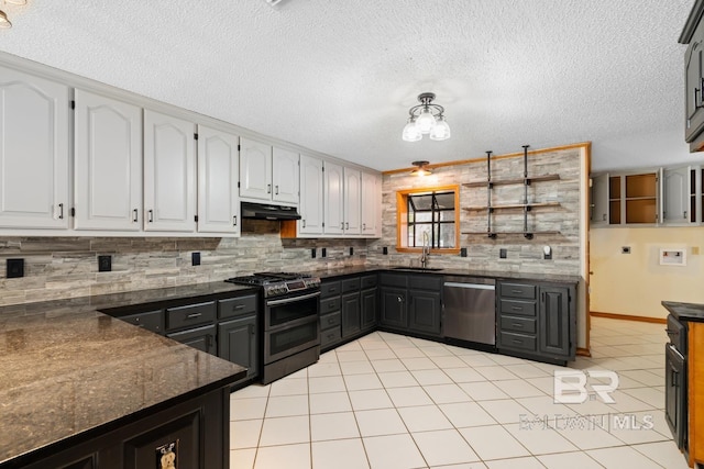 kitchen with white cabinets, sink, light tile patterned floors, tasteful backsplash, and stainless steel appliances