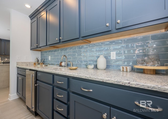 bar with wine cooler and backsplash