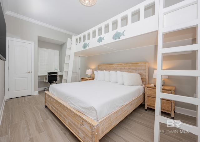 bedroom with ornamental molding