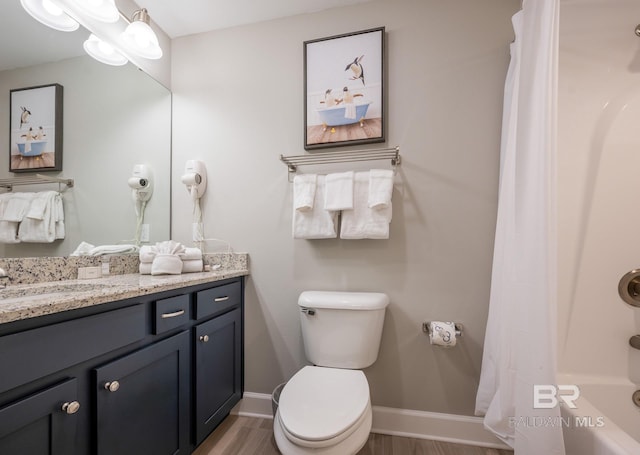 full bath featuring vanity, toilet, shower / bath combination with curtain, baseboards, and wood finished floors