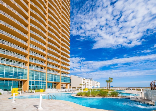community pool with a patio