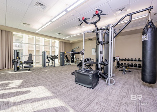 workout area with visible vents and carpet flooring