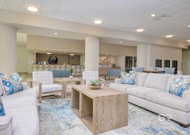 living area with recessed lighting and visible vents