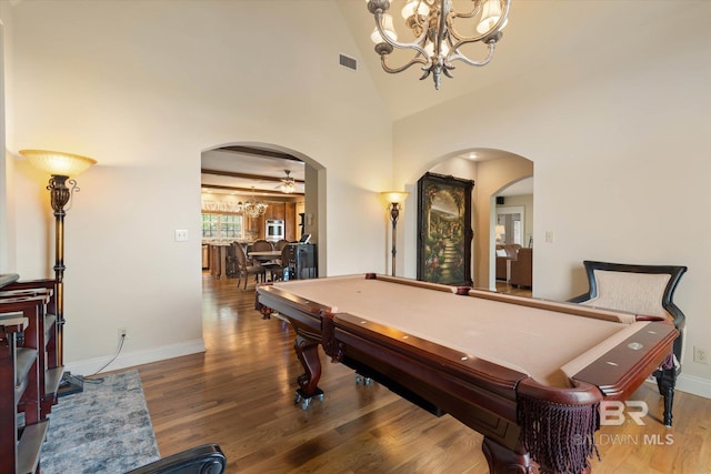 recreation room with arched walkways, an inviting chandelier, and billiards