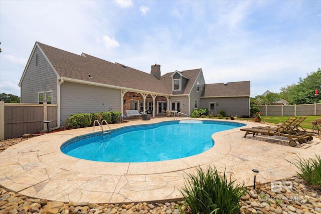 view of pool featuring a fenced backyard, a fenced in pool, and a patio area