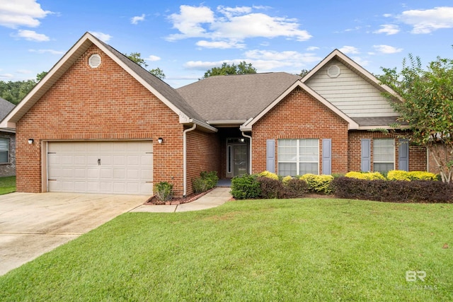 view of front facade with a front yard and a garage